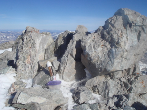Summit cannister with Sam the Wolfdog's ashes on the summit of Capitol Peak