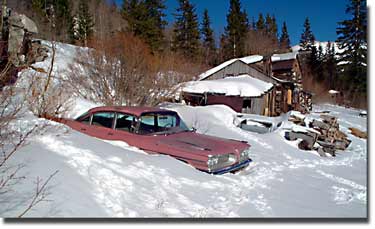 frozen in time--59 Pontiac with abandoned cabin
