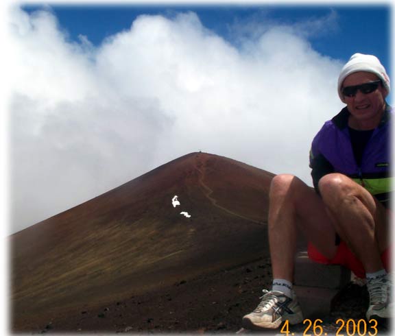 Steve and view to Mauna Kea Summit (Note snow to left of trail)